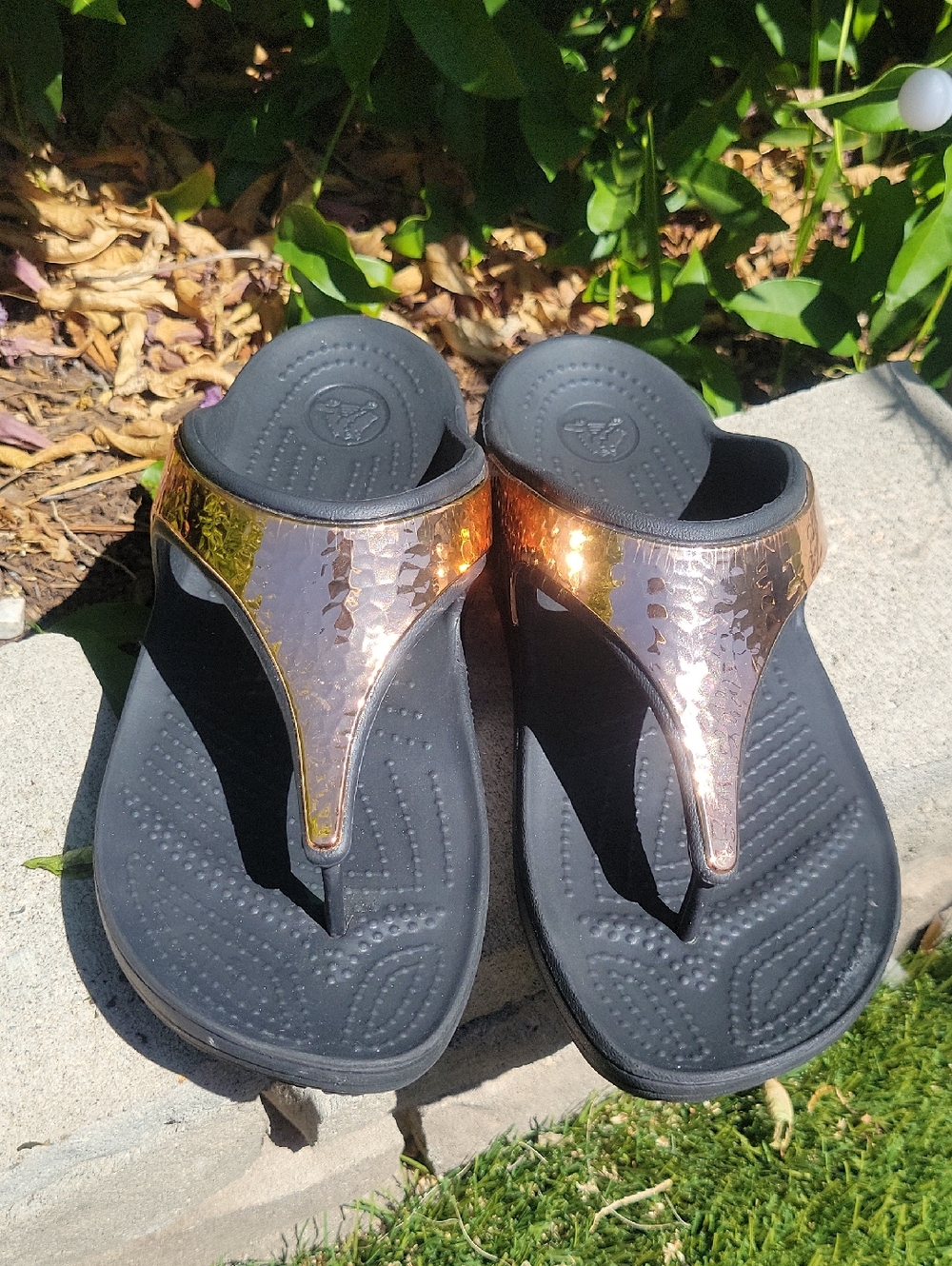 CROCS Black Sandals with Metallic Rose Gold Upper